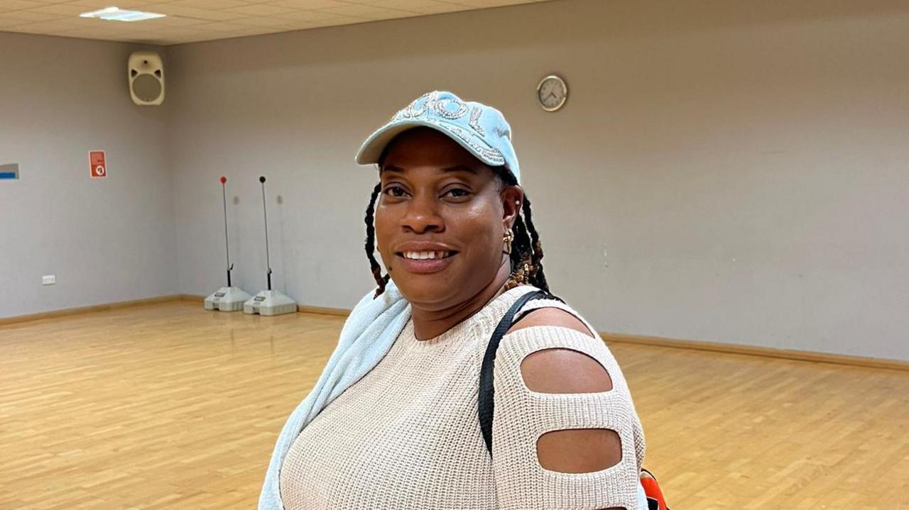 Amoya Harris-Welsh standing in an empty sports hall