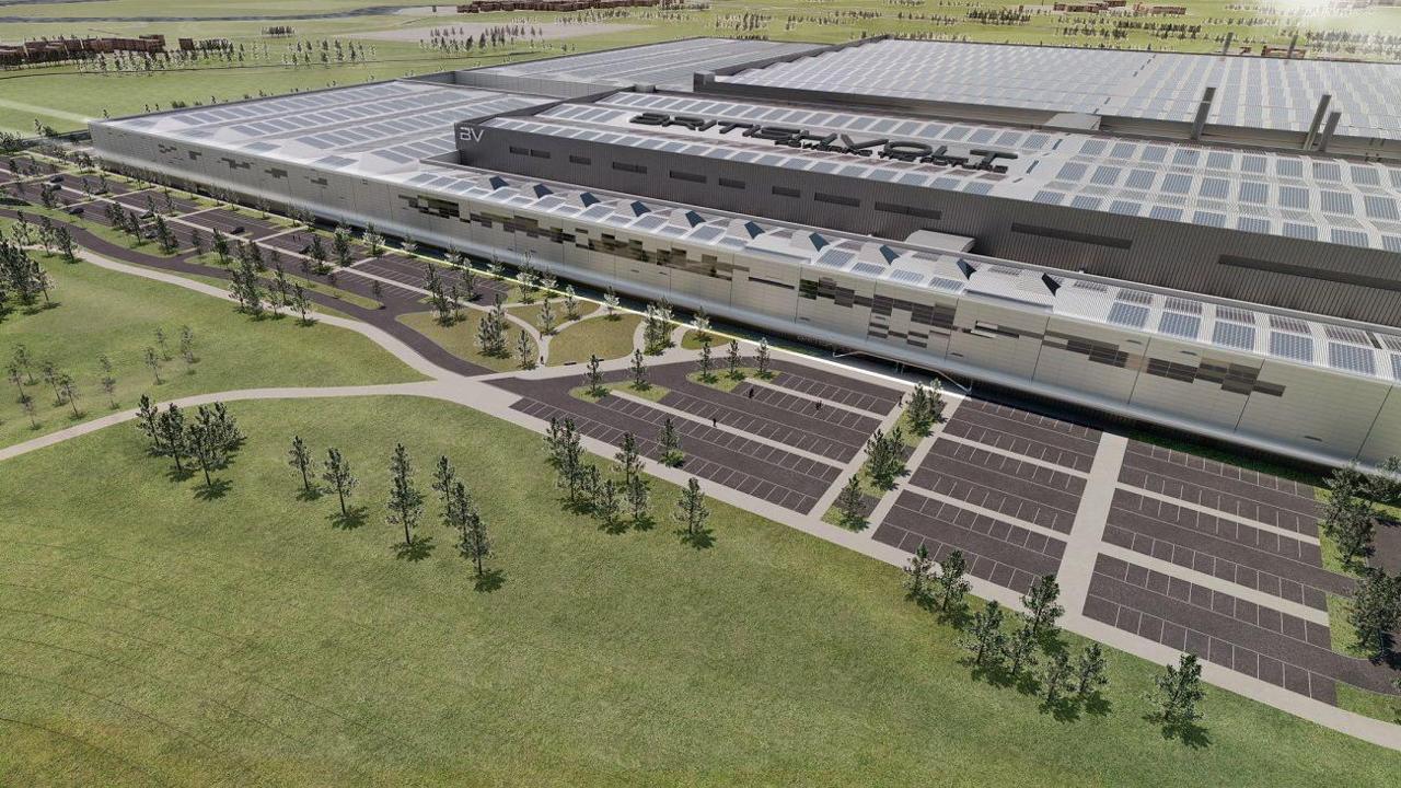 Artist's impression of the proposed Britishvolt gigafactory. The building is largely grey with a number of windows and a Britishvolt  logo on the roof. Next to the building are dozens of car parking spaces.