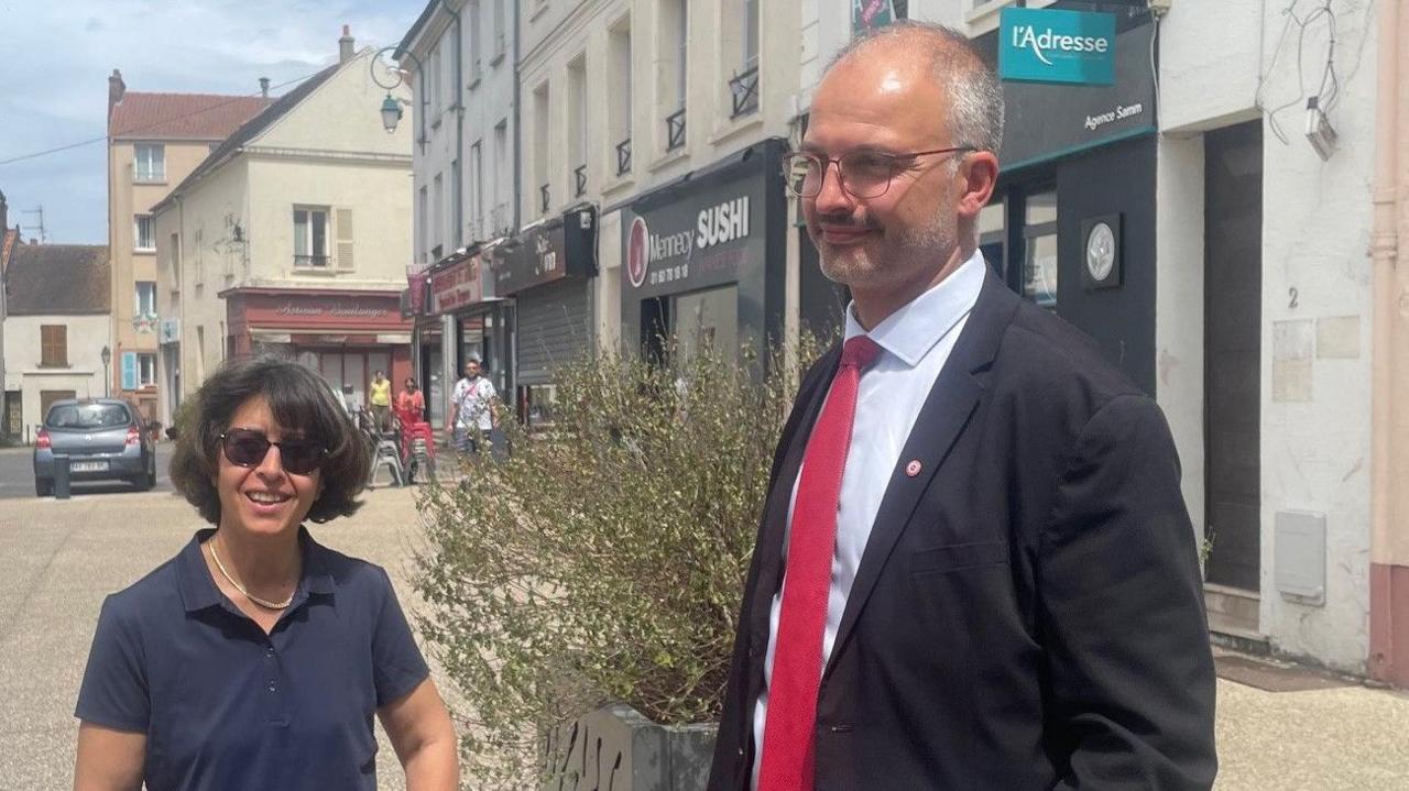 Matthieu Hillaire (R) with a supporter in Mennecy