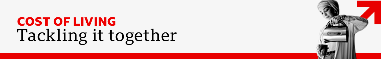 A red, black and white graphic reading Cost of Living Tackling It Together with a woman filling a mug from a kettle 