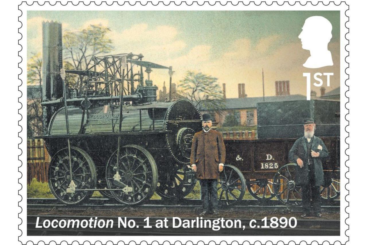 A first class stamp depicts the "Locomotion No.1 at Darlington, c.1890". Two men wearing top hats stand in front of the steam locomotive