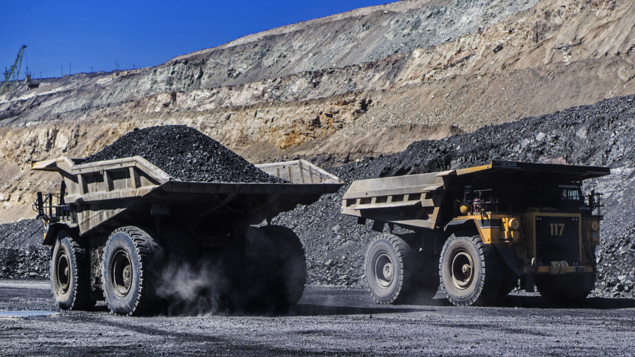 Haul trucks carry ore from an a mine in central Ukraine. File photo