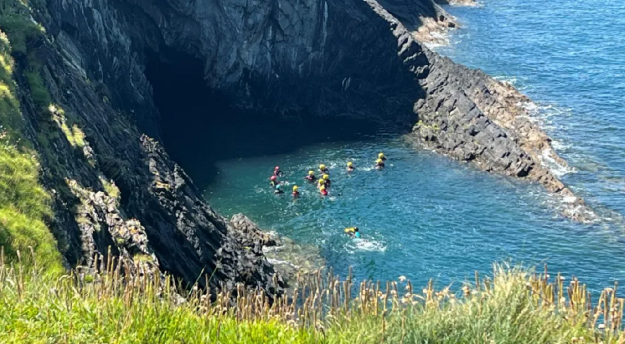 Picture of a coasteering group in Ceibwr Bay near Cardigan