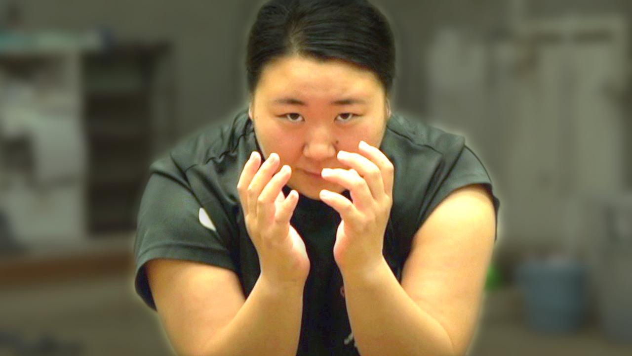 female wrestler in sumo pose