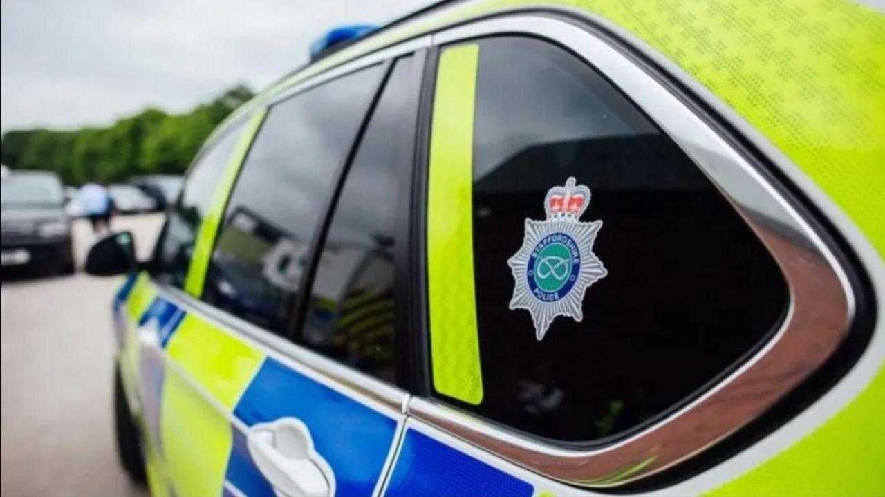 A police car, as viewed from the rear left hand side.