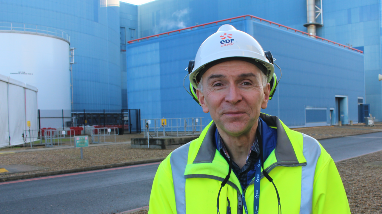 Robert Gunn wearing a hard hat and high vis jacket smiling into the camera