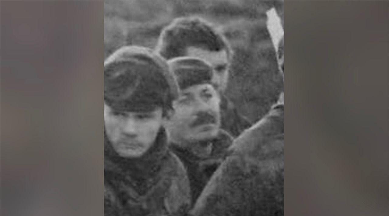 Black and white photo of three soldiers in army fatigues