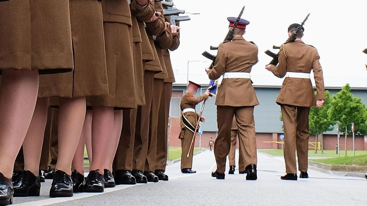 A stock image shows the feet of junior soldiers lining up with guns as they prepare to march ahead of their graduation parade at the Army Foundation College in 2015.