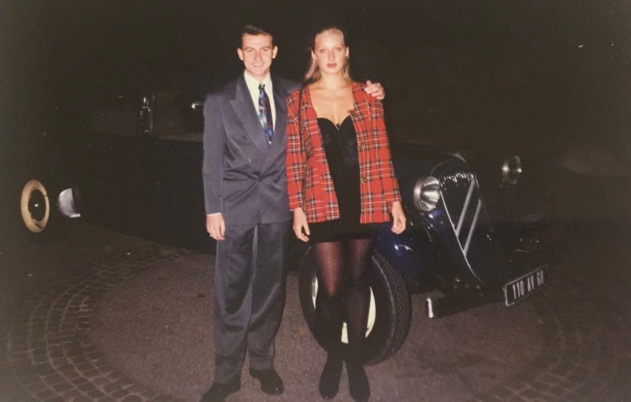 Howard and Bridgette stood in front of a car on their date in Germany, 1993