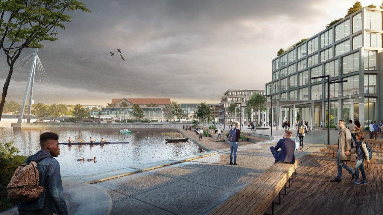 A CGI blueprint of what the medical school facility will look like. There is a modern building with glass panels, which sits opposite the water. People sit on a wooden bench where students sit and chat.