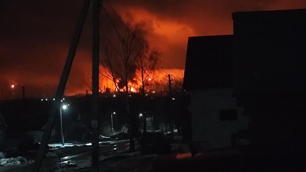 A photo of a dark night sky lit up by red flames