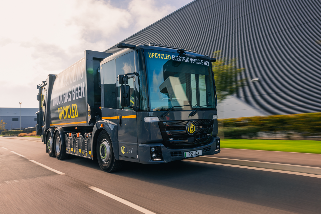 Grey electric refuse collection lorry