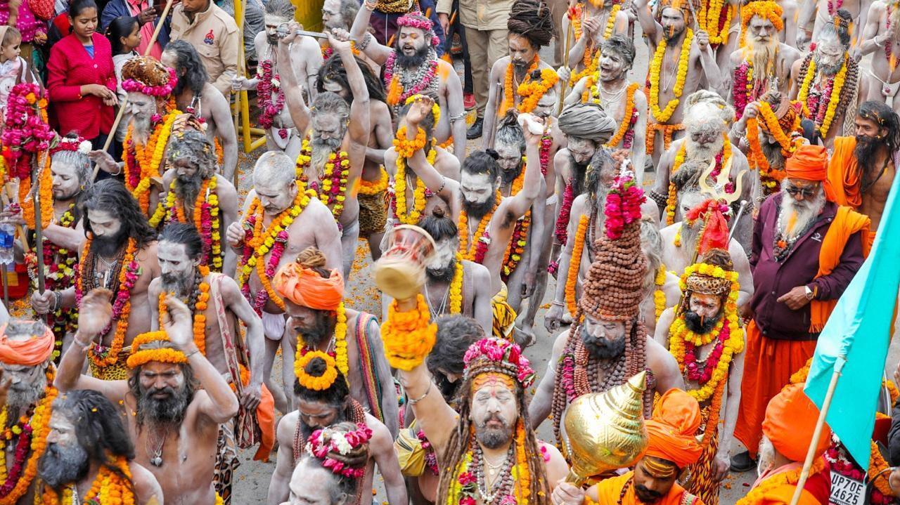 Dozens of holy men walking in a parade at the festival