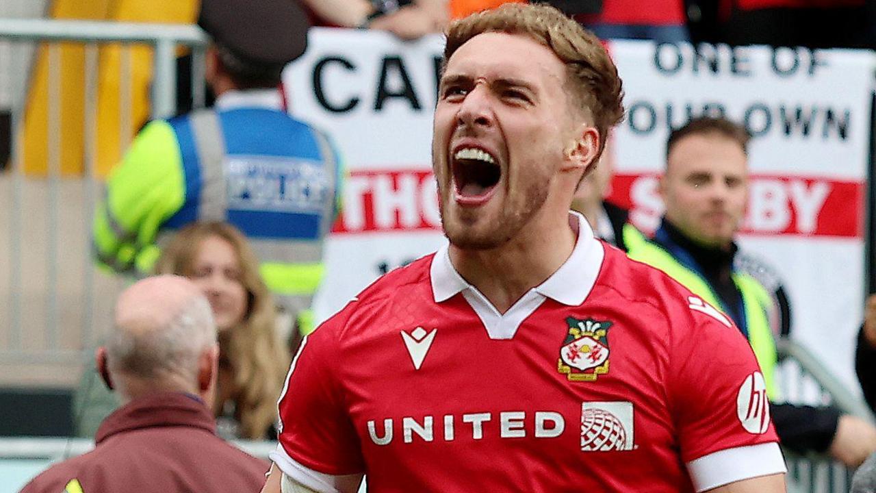 Wrexham striker Sam Smith celebrates