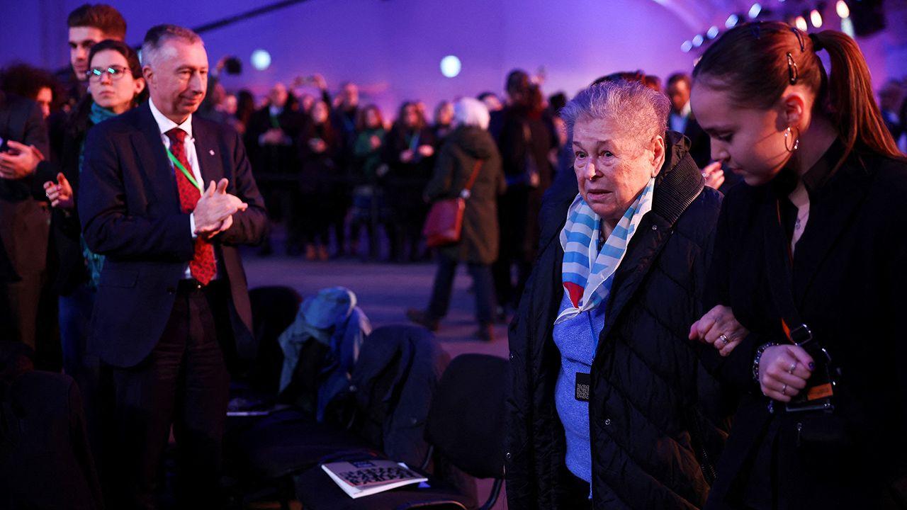 A holocaust survivor arrives at the event