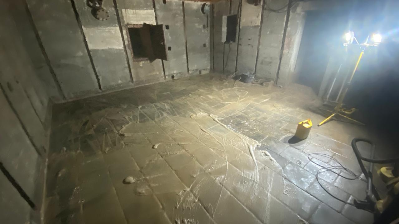 Inside a German World War Two bunker found under a house in Guernsey. Mud is on the floor.