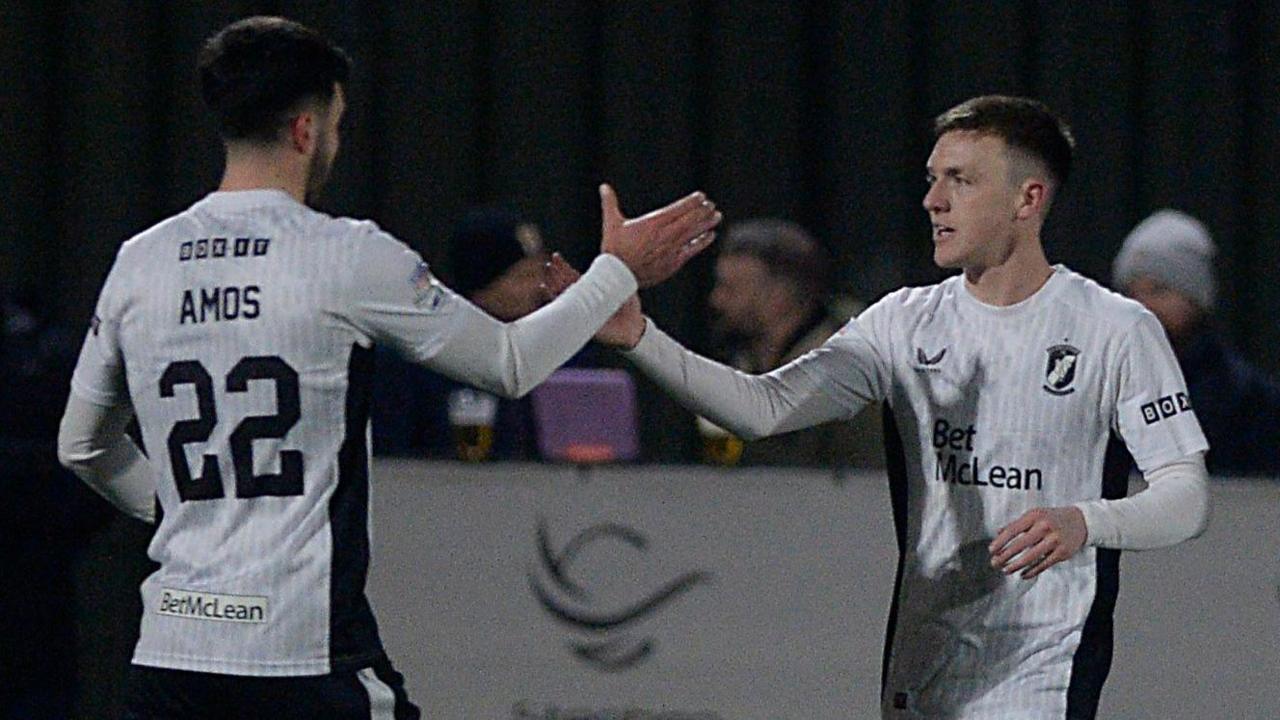 Danny Amos congratulates Glentoran goalscorer Jordan Jenkins