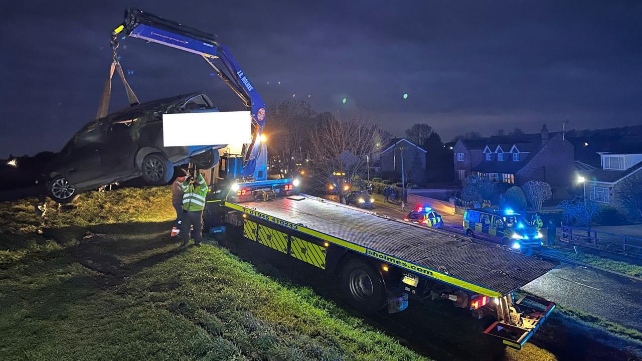 A car being taken away after a crash in Guyhirn