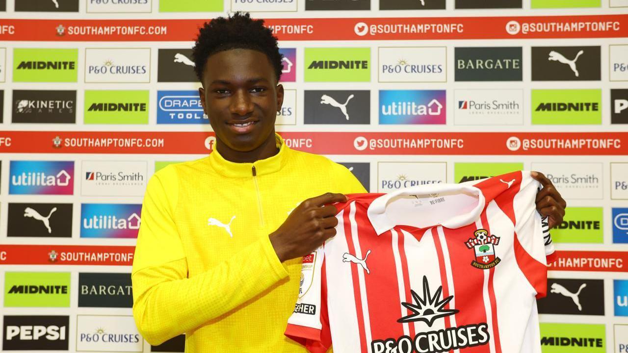 Southampton's latest signing Issa Tounkara poses for a photo holding the shirt
