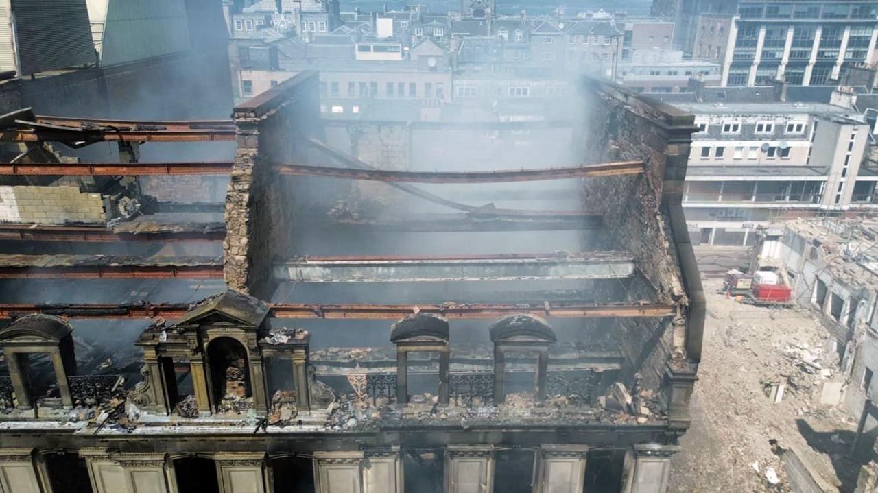 The charred remains of a former department store gutted by fire