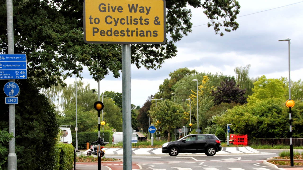 Dutch style roundabout with give way sign prioritising cyclists and walkers