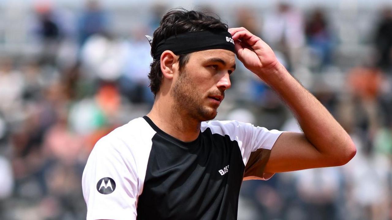 Taylor Fritz reacts during his match at the French Open