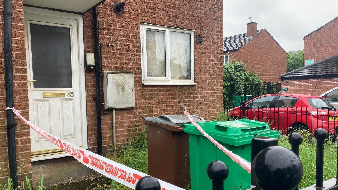A house in Hartley Road in Radford with it's entrance cordoned off