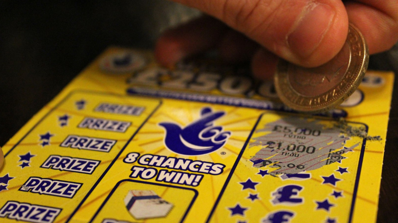 A person using a scratch card