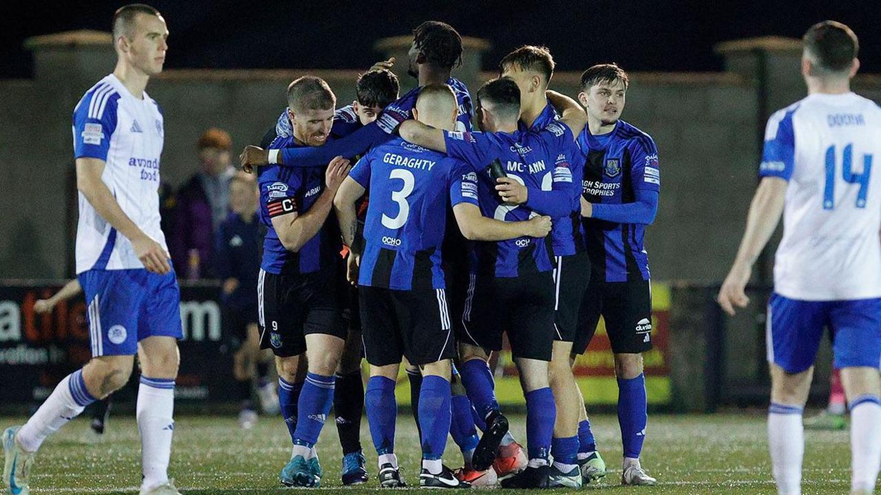 Armagh's players celebrate their win over Glenavon