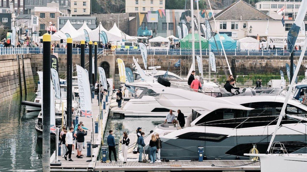 Visitors looking at some of the boats on display at the show