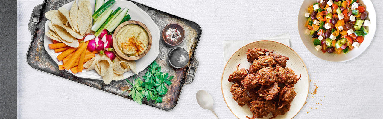 Hummus, bhaji and Greek salad feature on the street party table of 2011