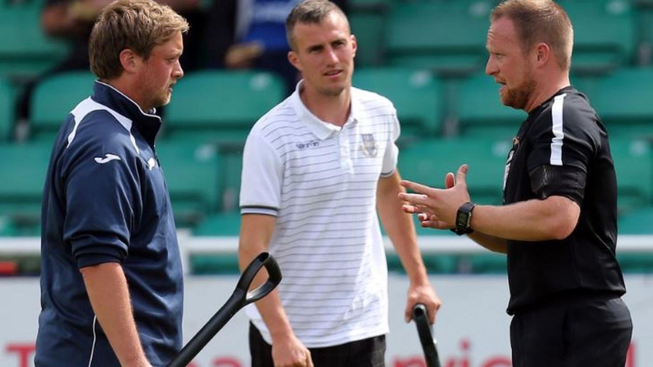 Referee David Rock speaks with Eastleigh ground staff before the match against Dagenham