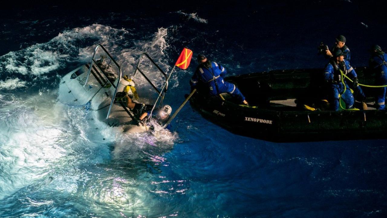 The DSV Limiting Factor submersible (left) prepares for a dive