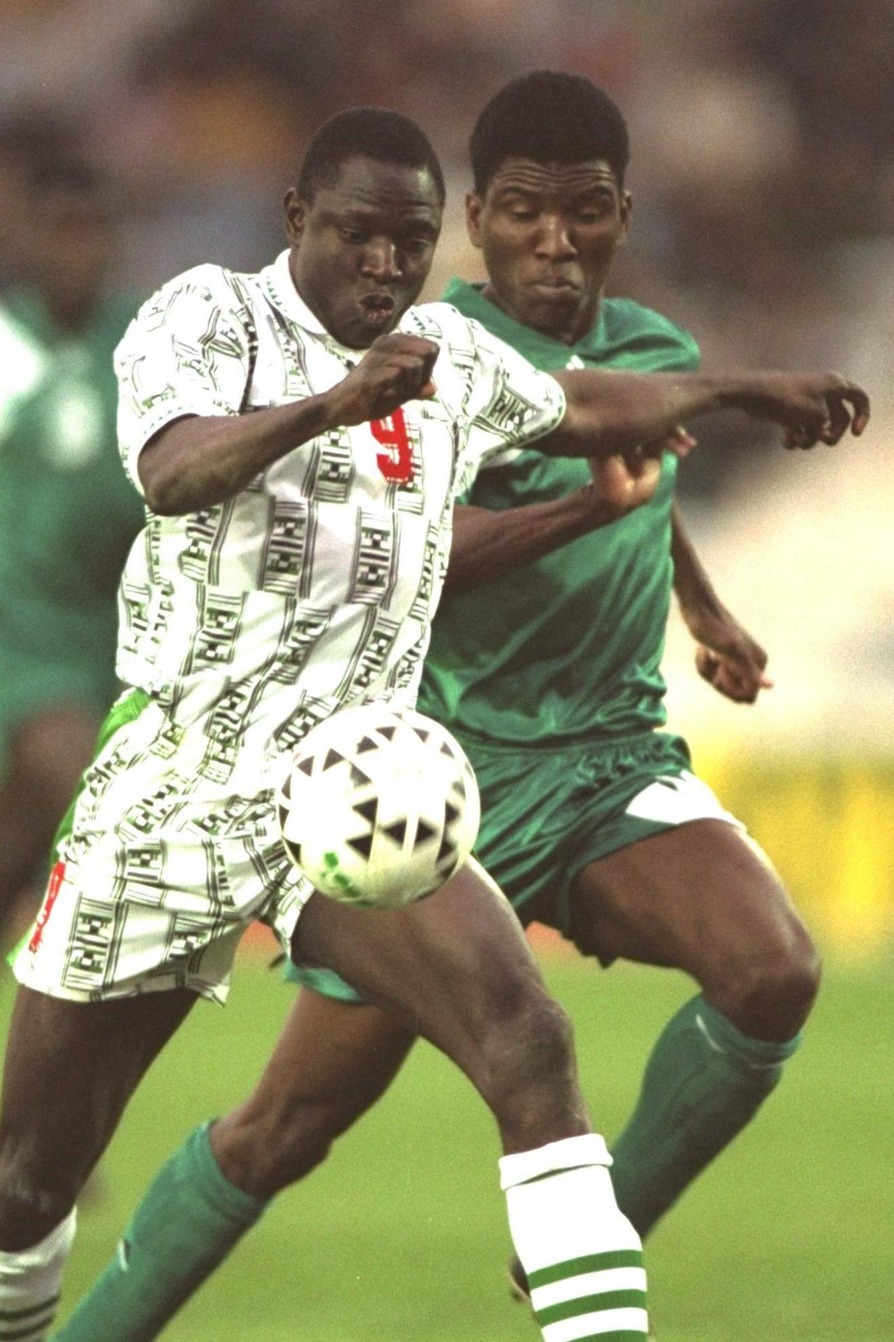 A Zambia defender contests the ball with a Nigeria striker in the final of the Africa Cup of Nations in 1994