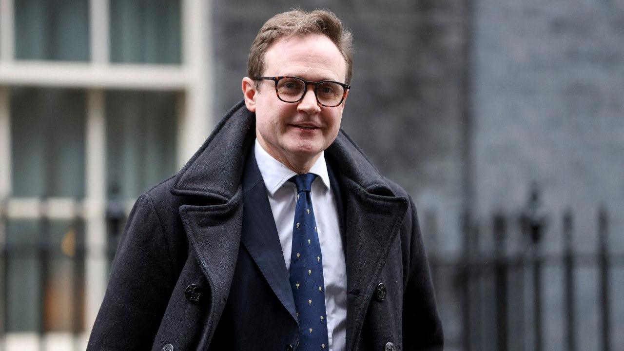 Tom Tugendhat wearing a suit and tie