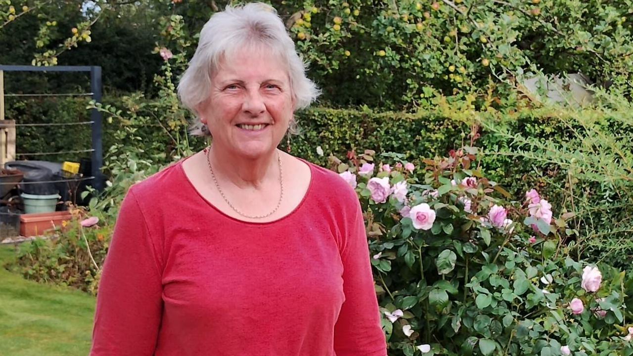 Judith Pitchforth in the garden of Broomhill Library