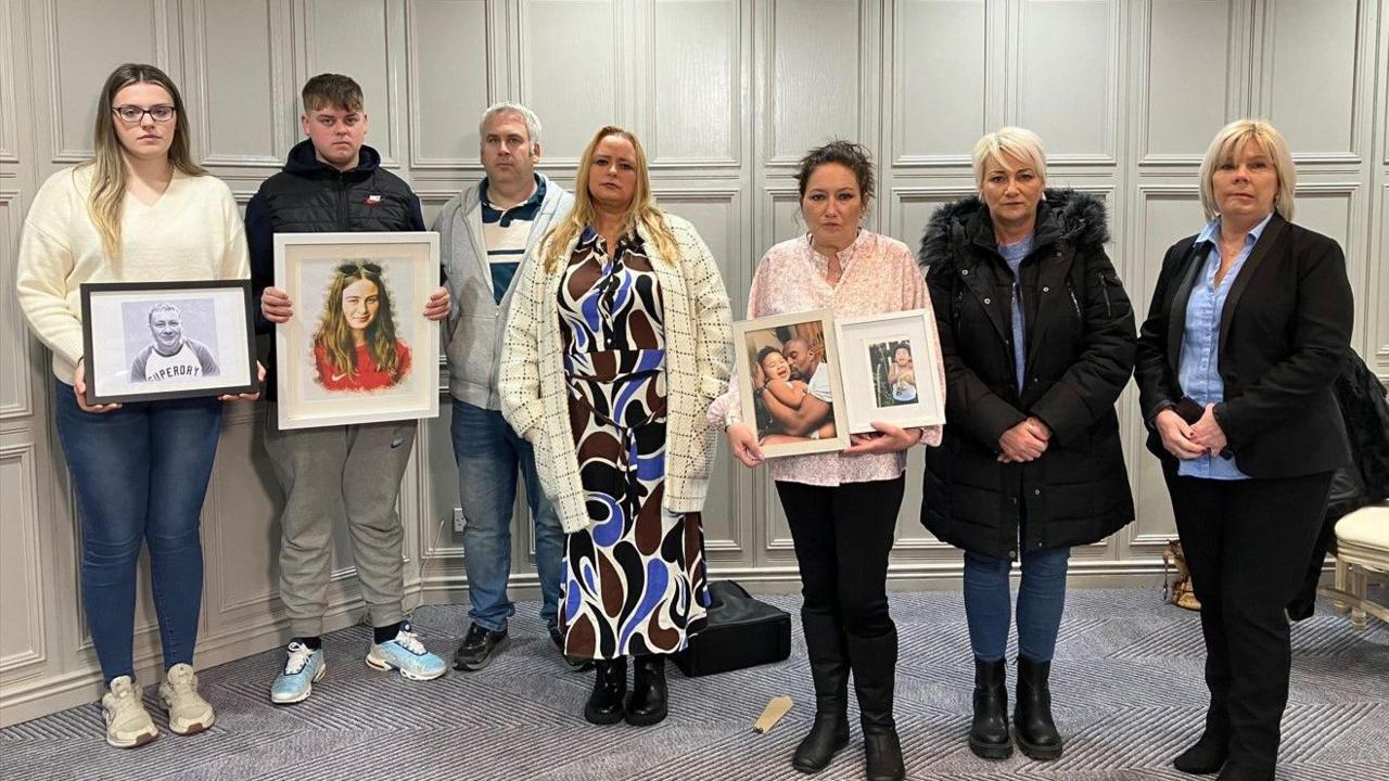 Creeslough families, some pictured holding portraits of their lost loved ones. 