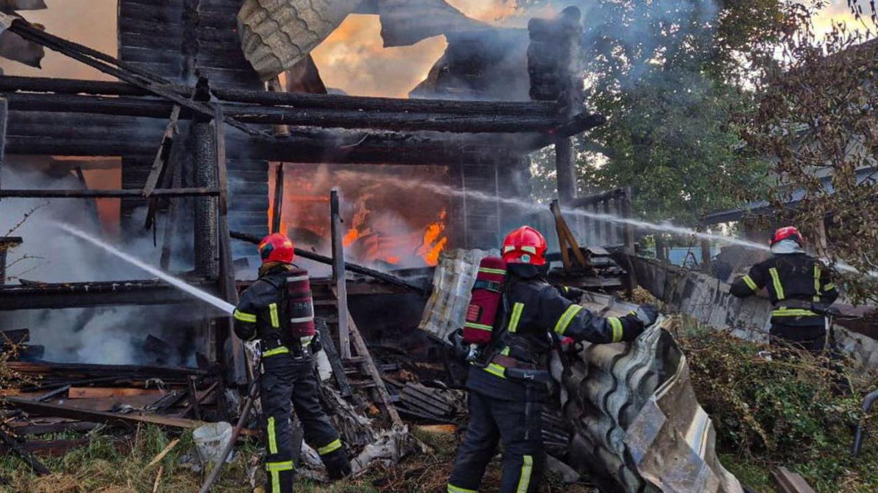 Firefighters work at the site of a residential area hit during Russian drone and missile strikes in Lviv 