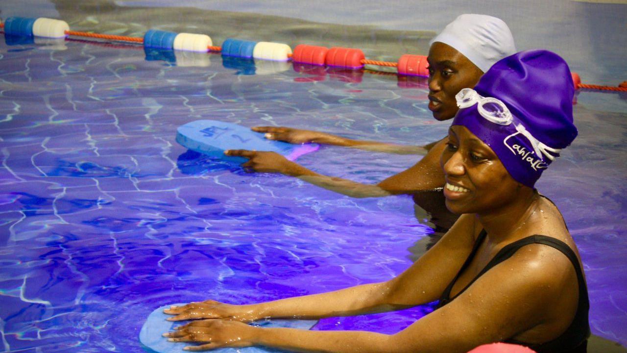 Two women in a swimming pool 