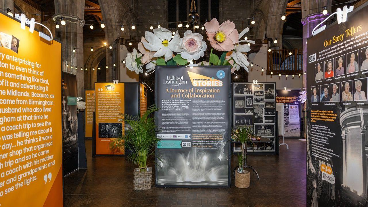 The inside of a church has a collection of displays talking about the history of the festival. 