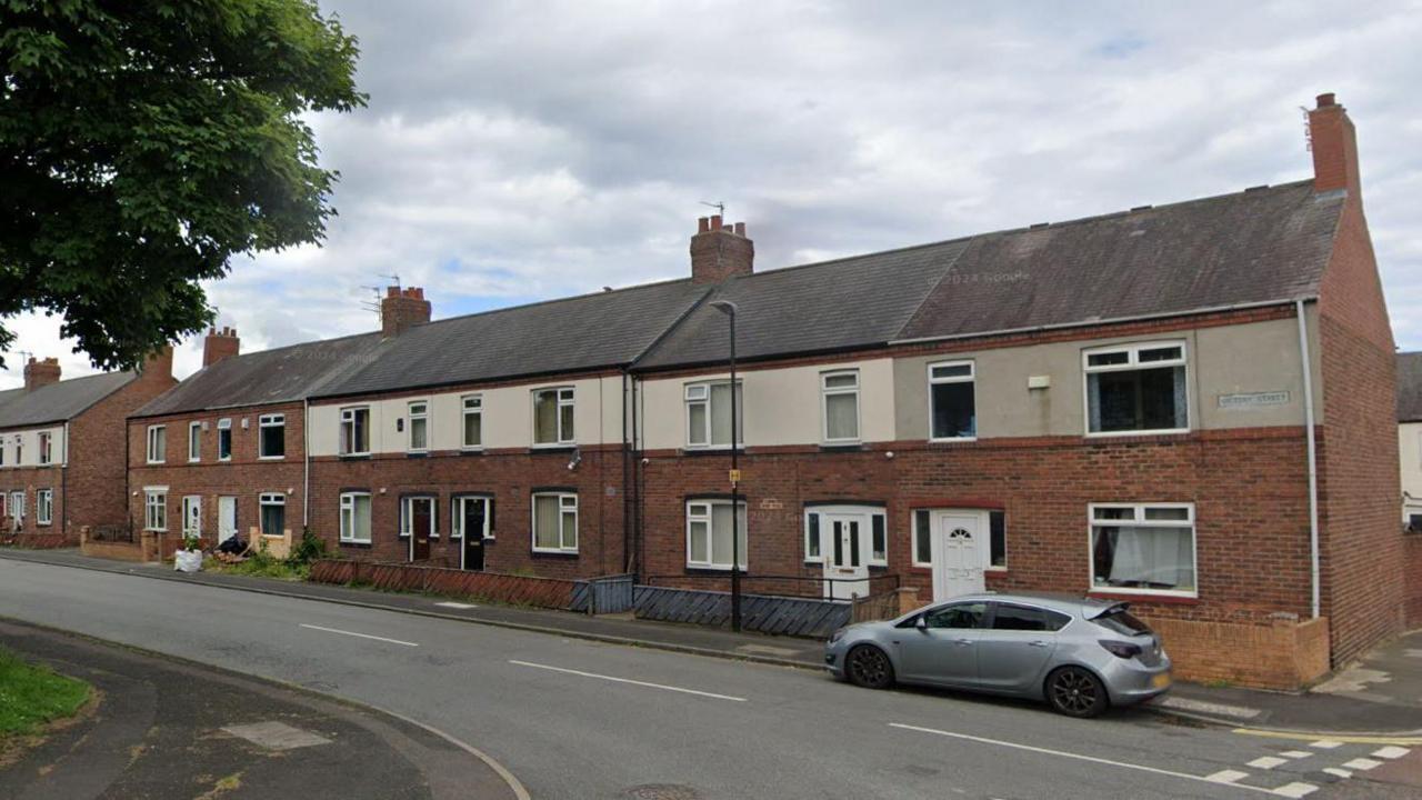 Victory Street in Sunderland. A car is parked outside a row of terraced houses.