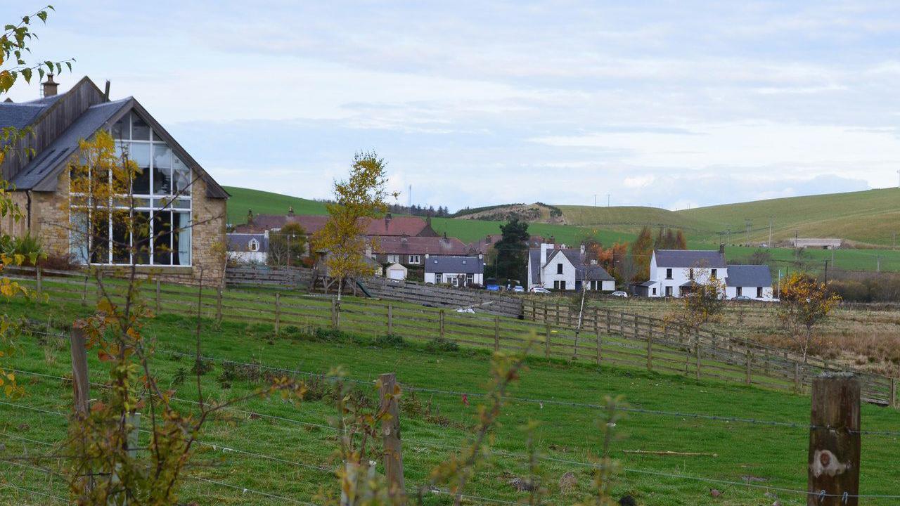 A selection of houses dotted across the countryside which make up the Borders village of Heriot