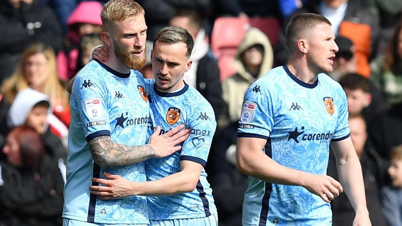 Hull City striker Oli McBurnie (left) is hugged by Liam Millar after his goal against Sheffield United