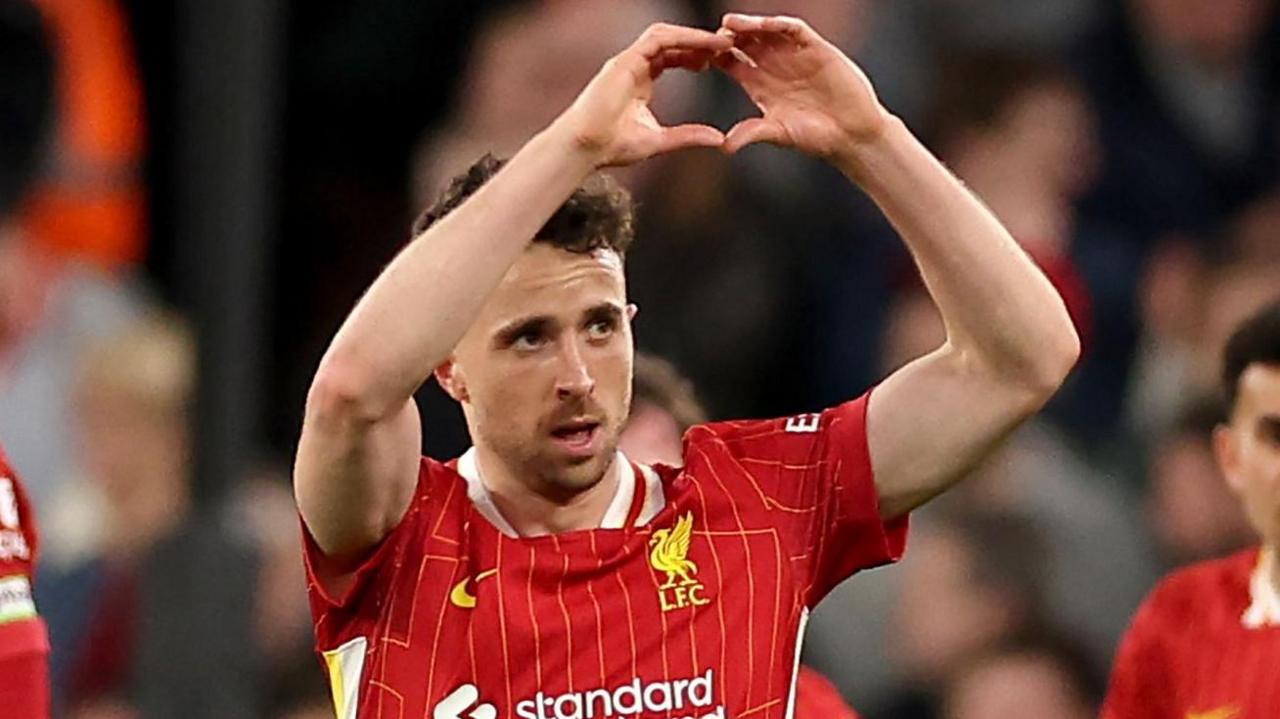 Diogo Jota makes a heart gesture towards Liverpool fans