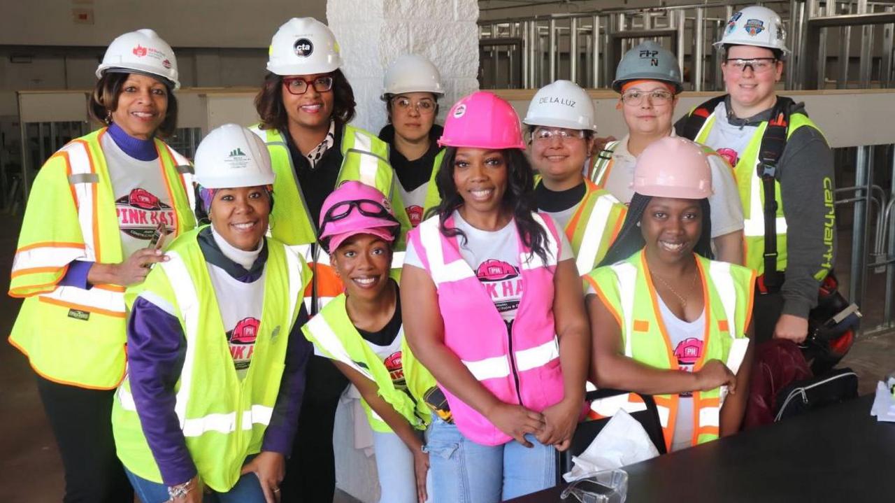 Traci Quinn with her daughters and other employees