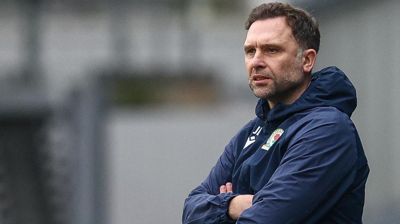 John Eustace watching Blackburn Rovers from the dugout