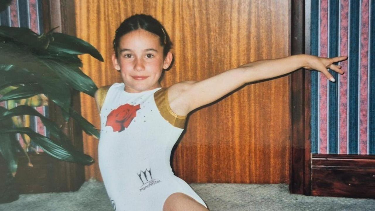 Sarah Davies Smale poses for a picture in gymnastics gear and pose in 2002