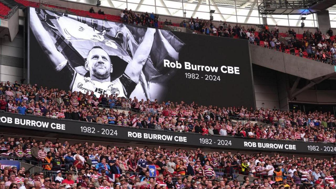 The large stadium screen showing a tribute to former Leeds Rhinos player Rob Burrow during the Betfred Challenge Cup final at Wembley Stadium