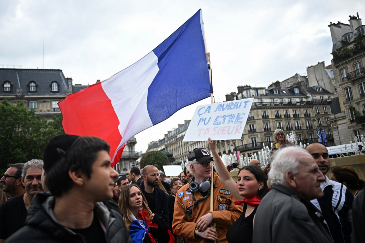 People attend a demonstration against anti-Semitism in front of Paris City Hall