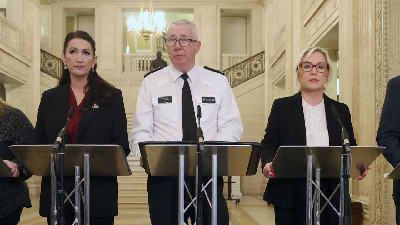 left-to right: Deputy First Minister Emma Little-Pengelly, Police Service of Northern Ireland Chief Constable Jon Boutcher, First Minister Michelle O'Neill 